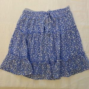 Blue mini skirt with white flower detail